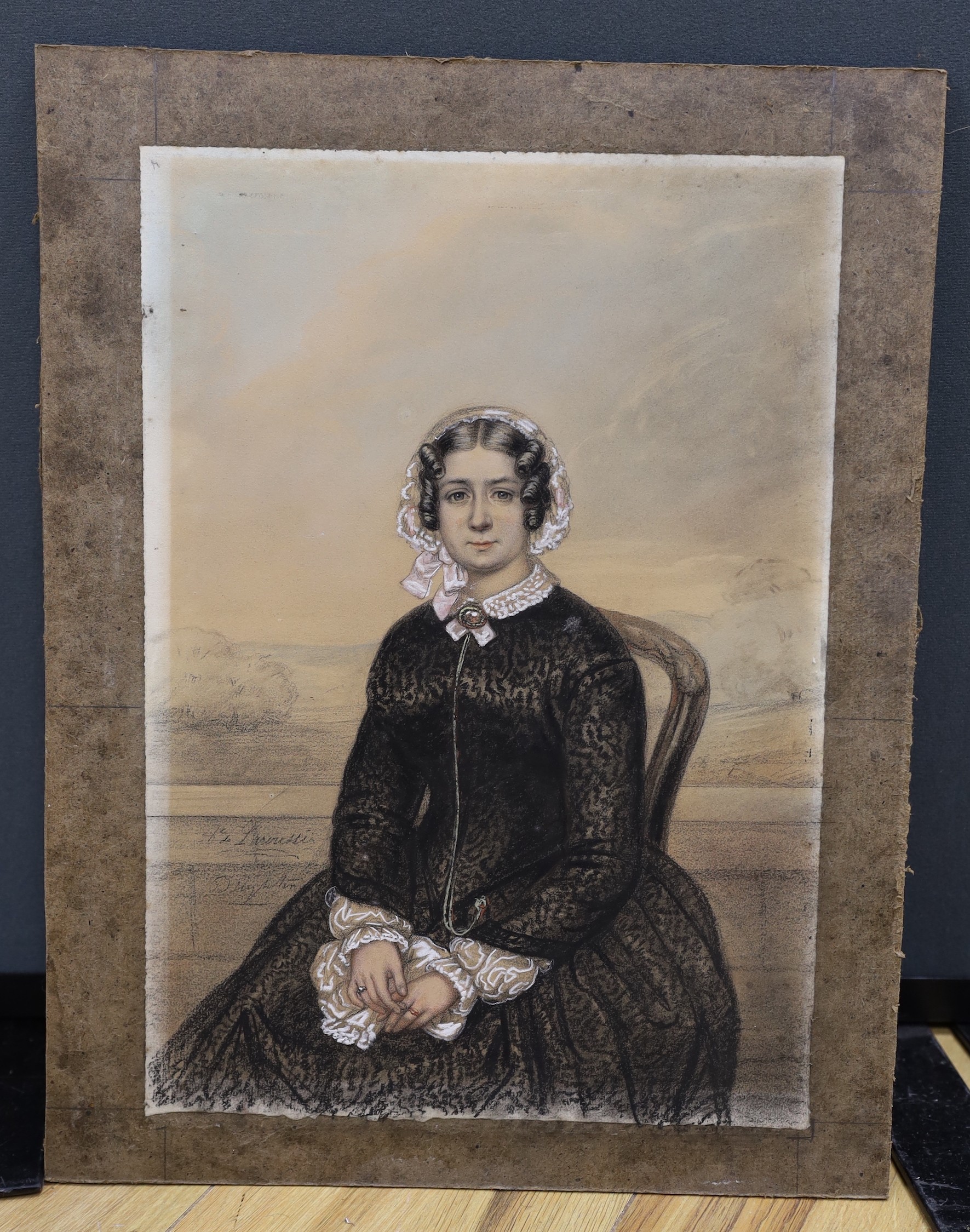 19th century French School, pencil and pastel, Portrait of a seated lady, indistinctly signed, 39 x 27cm, unframed